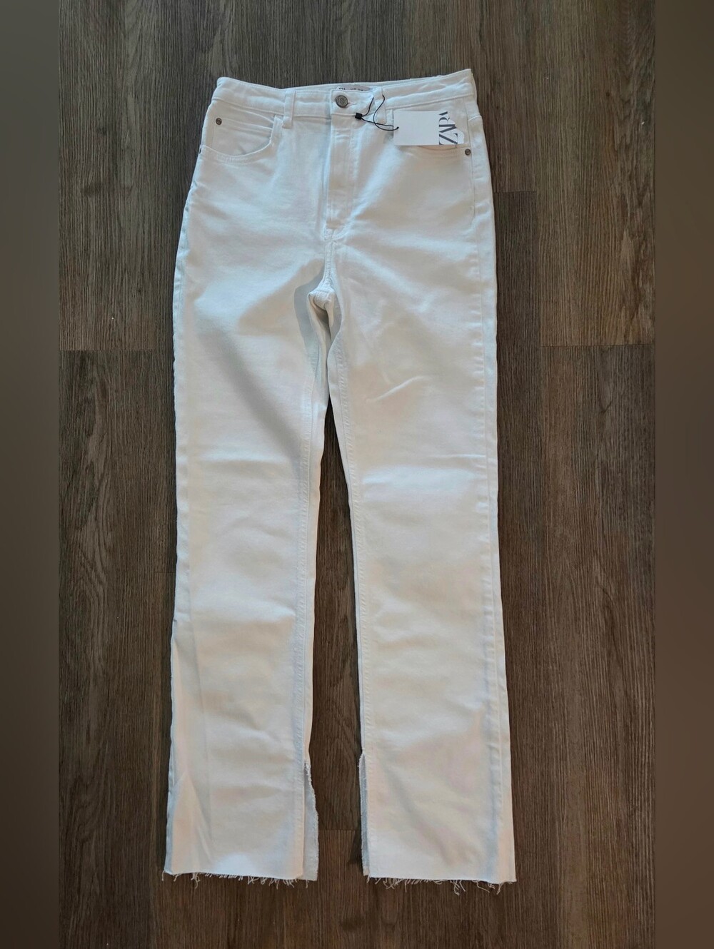 Zara slim flare jeans with raw cut hems and side slits